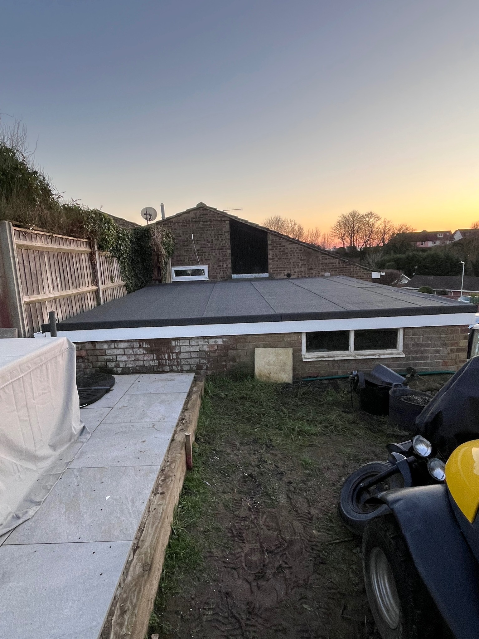 Traditional brick terrace house with completed red tiled roof
